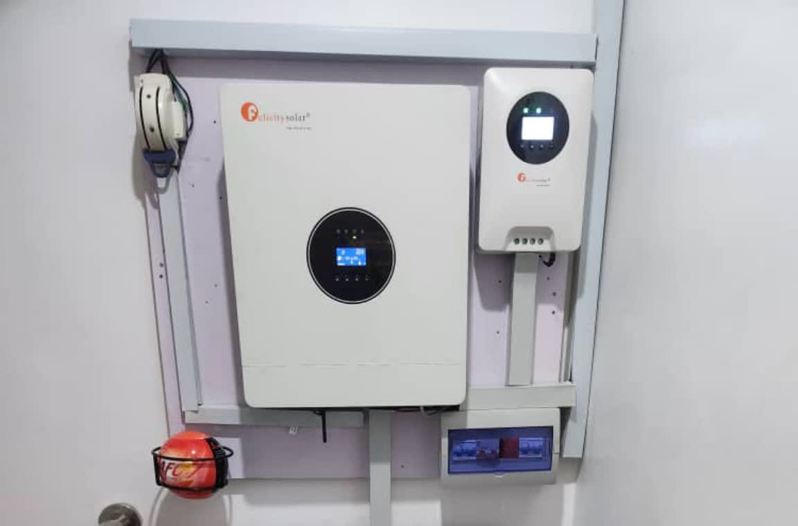 Close-up of a wall-mounted Felicity hybrid inverter and charge controller